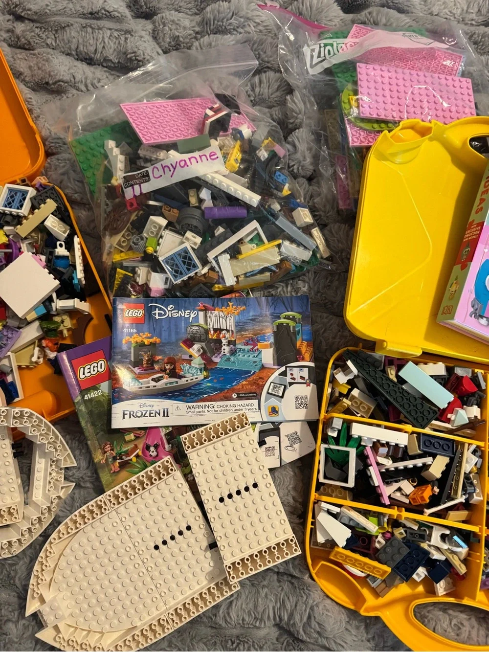 Lego Yellow and Orange Carry Cases filled with Lego bricks and a bag of boards